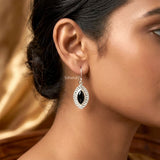 Lifestyle image — Black Onyx marquise silver earrings worn on ear