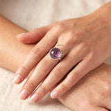 handcrafted knotted silver ring with amethyst