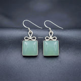 feminine silver bow earrings with gemstone India