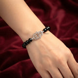 8mm Black Onyx gemstone bracelet with silver Hamsa