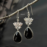 Close up of natural Black Onyx gemstone in 92.5 sterling silver lotus earrings