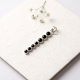 Handcrafted sterling silver pendant featuring Black Onyx gemstones