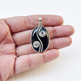 Spiral oval design silver pendant with Black Onyx stone