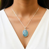 Facetted Blue Chalcedony natural stone silver pendant close-up