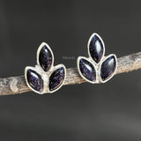 Close-up of Blue Sunstone leaf-design silver stud earrings
