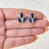 Pair of Blue Sunstone sterling silver stud earrings on display