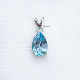 elegant teardrop blue topaz pendant close-up