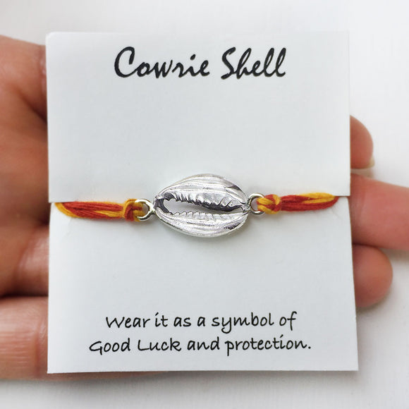 Traditional cowrie rakhi with silver thread design