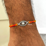 Handcrafted silver evil eye rakhi for Raksha Bandhan