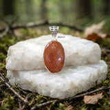 Elegant Golden Sunstone pendant with intricate jali work in sterling silver