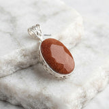 Handcrafted 925 sterling silver facetted Golden Sunstone jali pendant by Silberuh