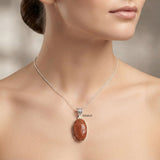 925 silver handcrafted pendant featuring facetted man-made Golden Sunstone