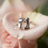 symbolic silver ring footprint design