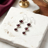 Natural red garnet triple-drop earrings in sterling silver