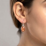 Oval golden shimmer earrings with a 925 silver setting