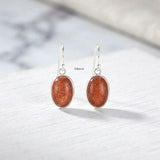 Man-made Golden Goldstone silver earrings for women