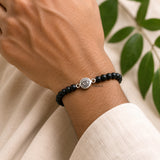 Unisex 925 Silver Evil Eye Karungali bracelet handcrafted by Indian artisans.