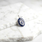 Natural Lapis Lazuli gemstone dolphin tail pendant close-up
