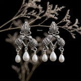 Handcrafted heritage-inspired silver earrings featuring elephants and pearls