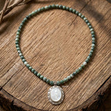 Handcrafted sterling silver necklace with Mother of Pearl and Tree Agate