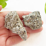 Raw pyrite stone cluster used for home decor and crystal healing