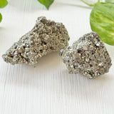 Natural raw pyrite cluster crystal with golden metallic shine