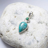 Handmade silver Chand pendant featuring genuine Turquoise gemstone
