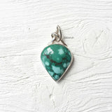 Handcrafted natural Turquoise knot pendant in 925 sterling silver