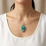 Natural Turquoise gemstone pendant with sterling silver knot design