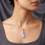 Drop-shaped sterling silver pendant with luminous Opalite stone