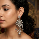 Bold tribal sterling silver earrings with peacock inspired design