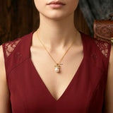 gold plated pearl drop bow necklace