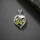 faceted peridot gemstone heart pendant sterling silver
