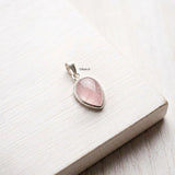 Handmade sterling silver pendant featuring natural Rose Quartz