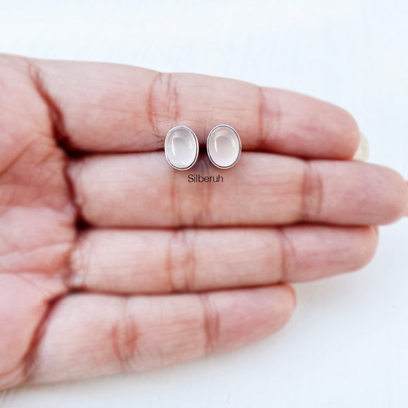 Oval-shaped silver rose quartz studs for women