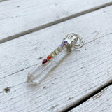Crystal Quartz point pendant featuring seven chakra gemstones