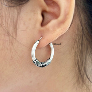 hoop earring with oxidised polish
