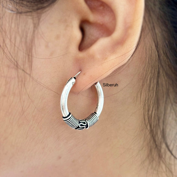 hoop earring with oxidised polish