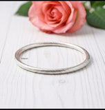 textured silver kada twisted design