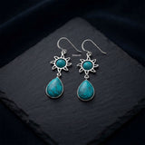 Turquoise Sun Drop silver earrings measuring 2.4 inches long