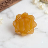 Yellow gemstone sacred footprints for a home mandir