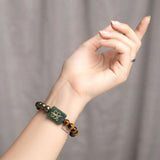 Handcrafted Zibu Abundance gemstone bracelet featuring Green Aventurine Zibu Coin
