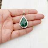 Handcrafted silver pendant featuring green malachite stone