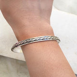 KNOTTED SILVER SPINNER BANGLE - SILBERUH