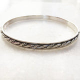 KNOTTED SILVER SPINNER BANGLE - SILBERUH