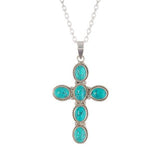 handcrafted silver cross pendant with turquoise gemstone